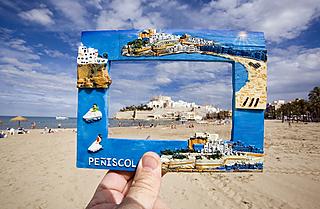 A picture frame blends in with the beach at Peníscola