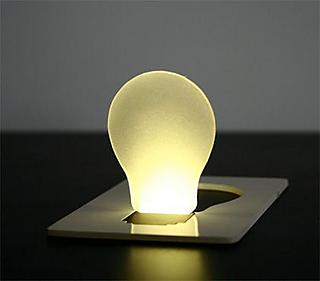 The bulb lights up when you flip the paperboard open