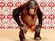 Cute monkey against red backdrop