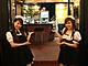 Two waitresses outside a Maid Café