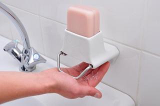 Convenient dispenser for bars of soap  
